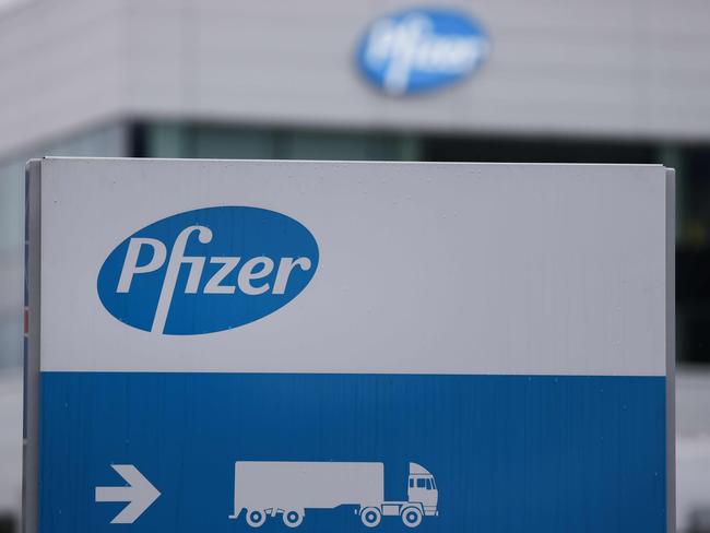 The logo of US multinational pharmaceutical company Pfizer, is pictured at a factory in Puurs, where Covid-19 vaccines are being produced for Britain, on December 3, 2020. - Britain on December 2, 2020 became the first western country to approve a Covid-19 vaccine for general use, while Japan and Italy pledged free inoculations for all even as the global death toll rose towards 1.5 million. (Photo by Kenzo TRIBOUILLARD / AFP)