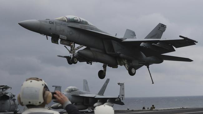 An F/A-18 Super Hornet fighter approaches the deck of the USS Carl Vinson. Picture: AP Photo/Lee Jin-man