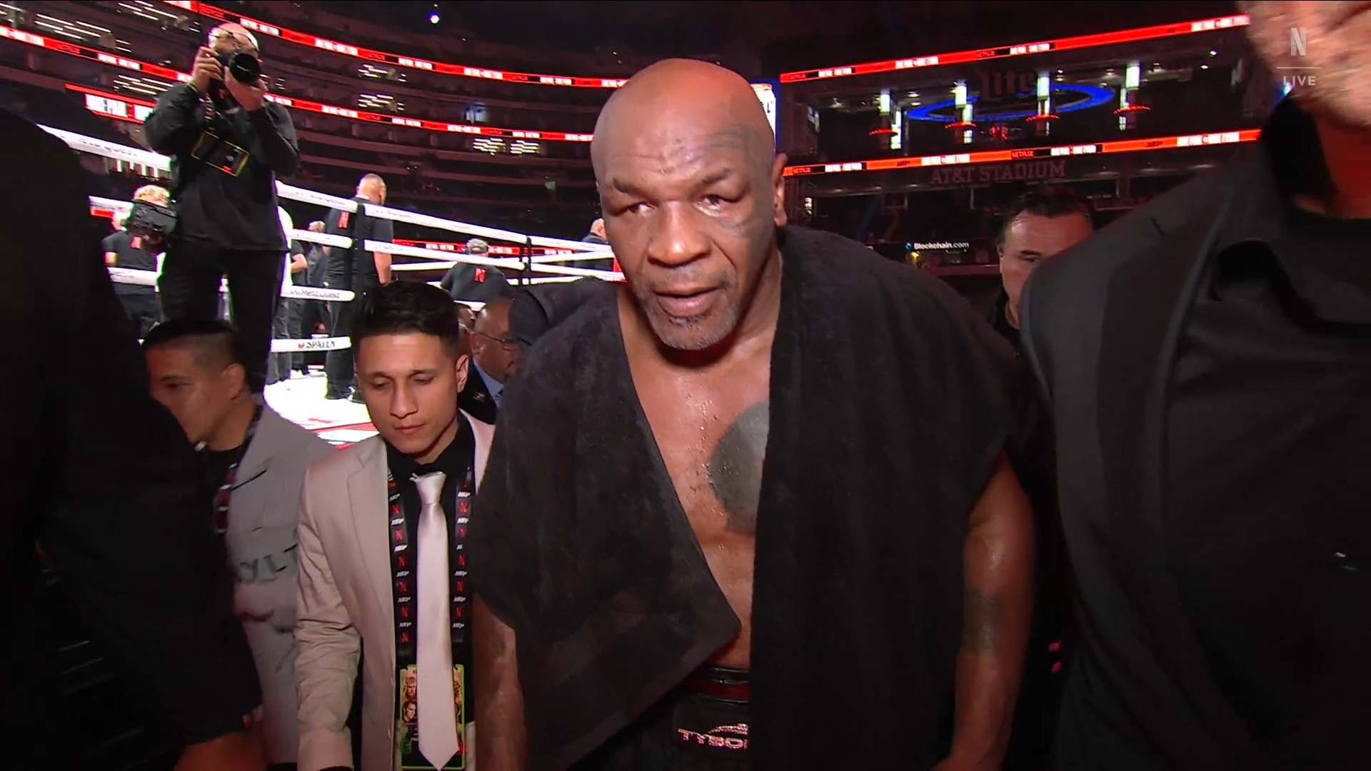 Mike Tyson looks every bit his age leaving the ring. Photo: Netflix.