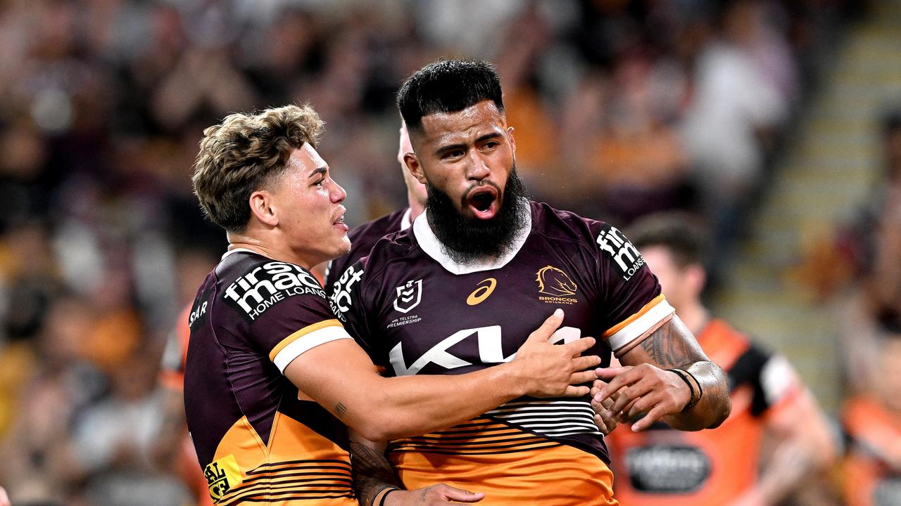 BRISBANE, AUSTRALIA - APRIL 01: Payne Haas of the Broncos celebrates with team mate Reece Walsh of the Broncos after scoring a try during the round five NRL match between Brisbane Broncos and Wests Tigers at Suncorp Stadium on April 01, 2023 in Brisbane, Australia. (Photo by Bradley Kanaris/Getty Images)