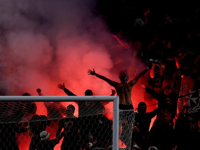 Wanderers fans let off a flare during the round 18 A-League Men match between Sydney FC and Western Sydney Wanderers at Allianz Stadium. Picture: Brendon Thorne/Getty Images