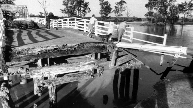 The Snowy River bridge on the Princes Highway was wrecked when a hayshed splintered the trestles during the 1971 flood.