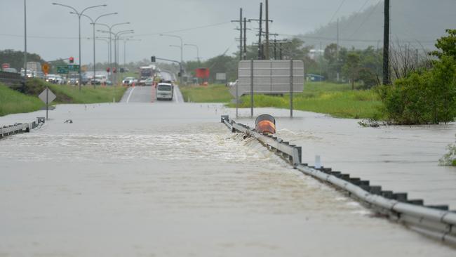 Flooding across Townsville. Lower Bridge closed on the Bohle River as overflow covers the road. Picture: Alix Sweeney