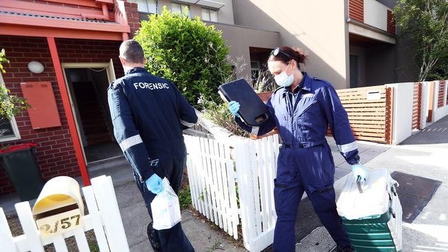 Detectives and forensic police enter Ms Gatt’s home in Kensington last year. Picture: Aaron Francis/The Australian