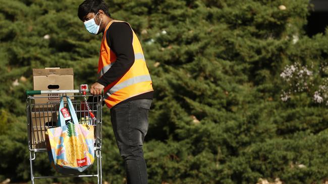 Food and essentials are distributed at the Alfred Street Public Housing Complex in North Melbourne on Friday. Picture: Darrian Traynor/Getty Images