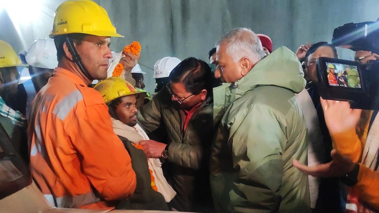 The rescued workers were greeted by officials and the press before being taken to ambulances. Picture: AFP PHOTO / Department of Information and Public Relation (DIPR) Uttarakhand