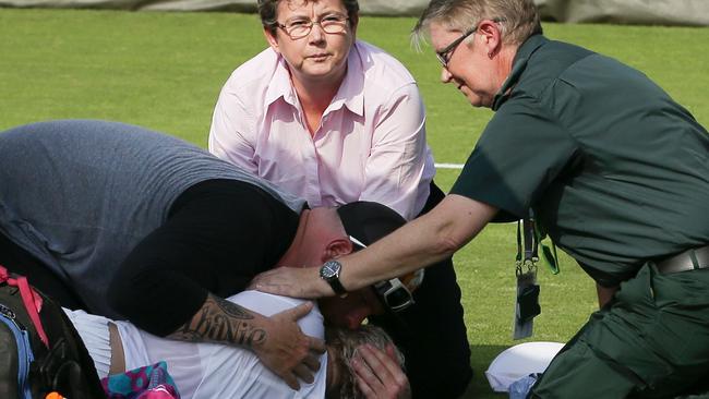 Bethanie Mattek-Sands is helped after her injury. Picture: AFP Photo