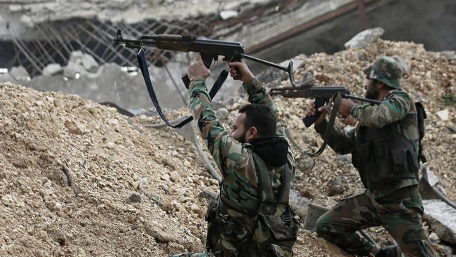 Syrian government troops fight rebel fighters east of Aleppo in December 2016. The government seized large swaths of the Aleppo enclave under rebel control since 2012 in the offensive that began last week. The fighting was most intense Monday near the dividing line between east and west Aleppo as government and allied troops push their way from the eastern flank, reaching within less than a kilometer (half a mile) from the citadel that anchors the center of the city. (AP Photo/Hassan Ammar)