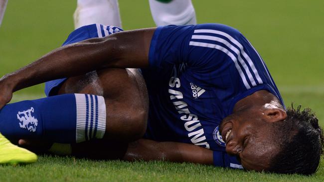 Chelsea's Ivorian forward Didier Drogba lays on the pith at the Groupama Arena.