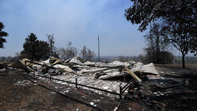 The burnt remains of a house destroyed in a bushfire seen Kabra, Queensland, last November. Picture: AAP