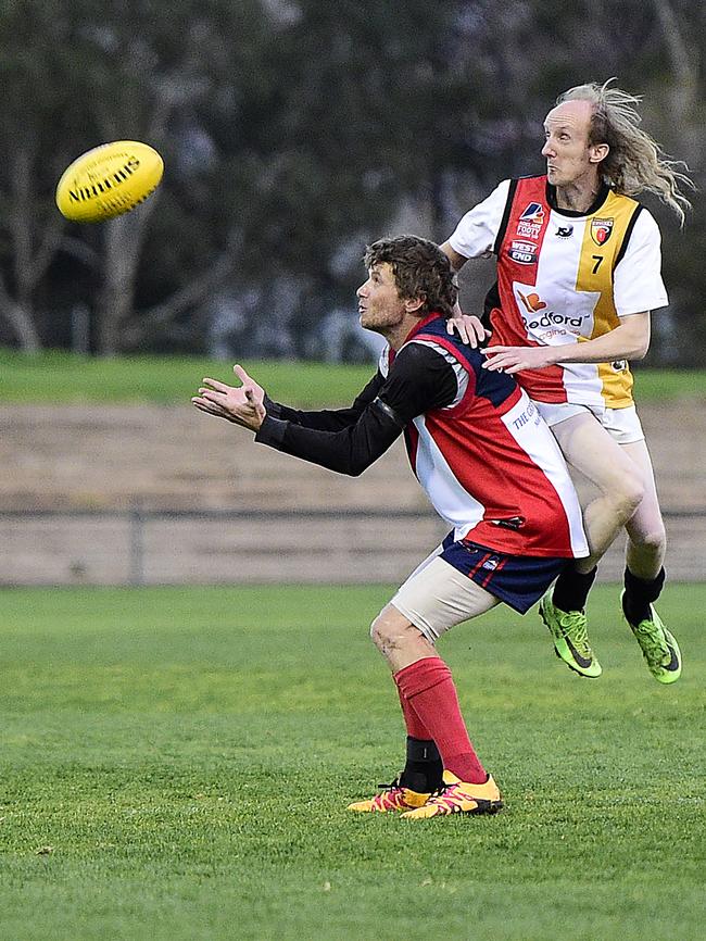 Eastern Park Football Club player Scot May and Goodwood Saints' Renaldo Montin. Picture: Bianca De Marchi/AAP