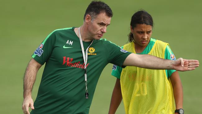 Ante Milicic gives Sam Kerr instructions at training.