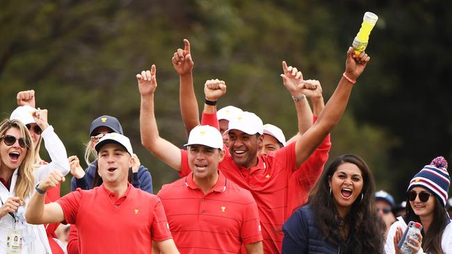 Justin Thomas, Gary Woodland, Tony Finau, Xander Schauffele and Webb Simpson of the United States team celebrate winning the Presidents Cup.