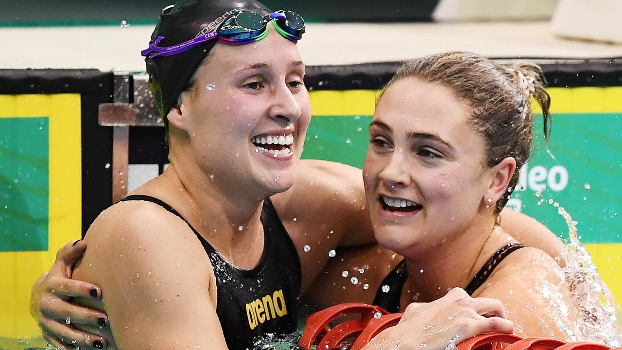 Strauch (right) hugs Mikayla Smith after winning the women's 200m breaststroke final. Picture: Getty Images