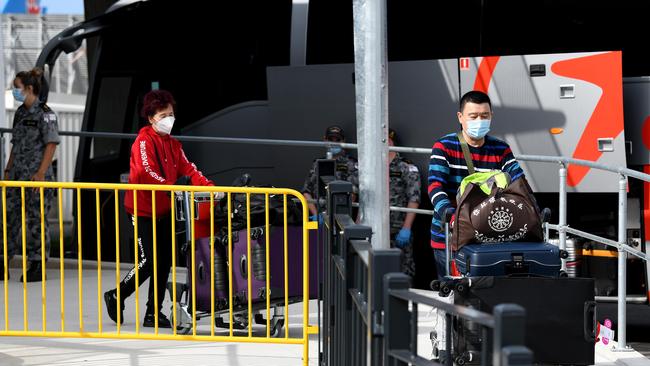 Passengers arriving off international flights are seen boarding charted buses to be taken to commence their 14 day COVID-19 hotel quarantine in Sydney. Picture: NCA NewsWire/Bianca De Marchi