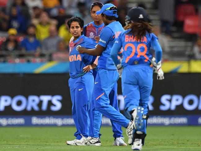 Poonam Yadav (left) of India celebrates after taking the wicket of Alyssa Healy. Picture: AAP IMAGE/DEAN LEWINS