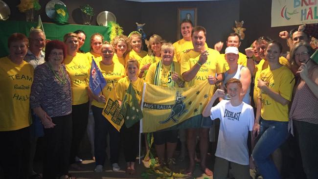 Family and friends of swimmer Brenden Hall gather at his Petrie home to cheer him on to Paralympic Games glory this morning.