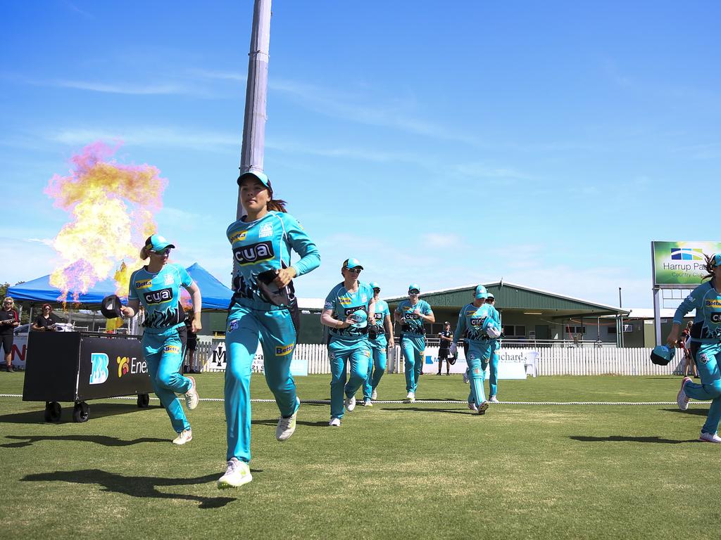 The Brisbane Heat enter the field ahead of their Women's Big Bash League match against the Melbourne Renegades at Harrup Park in Mackay. (AAP Image/Dave Acree)