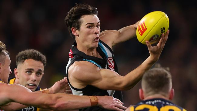 ADELAIDE, AUSTRALIA - MAY 02: Connor Rozee of the Power handpasses the ball during the 2024 AFL Round 08 match between the Adelaide Crows and the Port Adelaide Power at Adelaide Oval on May 02, 2024 in Adelaide, Australia. (Photo by Sarah Reed/AFL Photos via Getty Images)