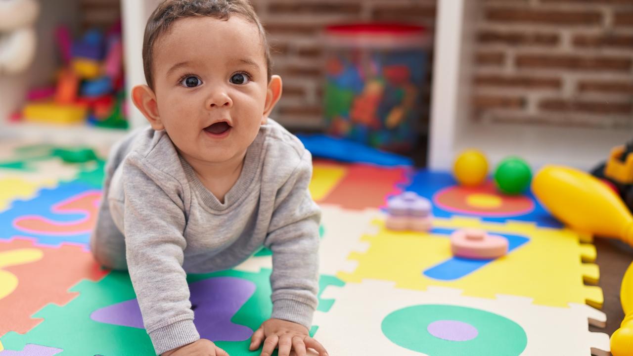 Babies should be encouraged to stretch and reach for objects and have supervised interactive floor-based play. Picture: iStock