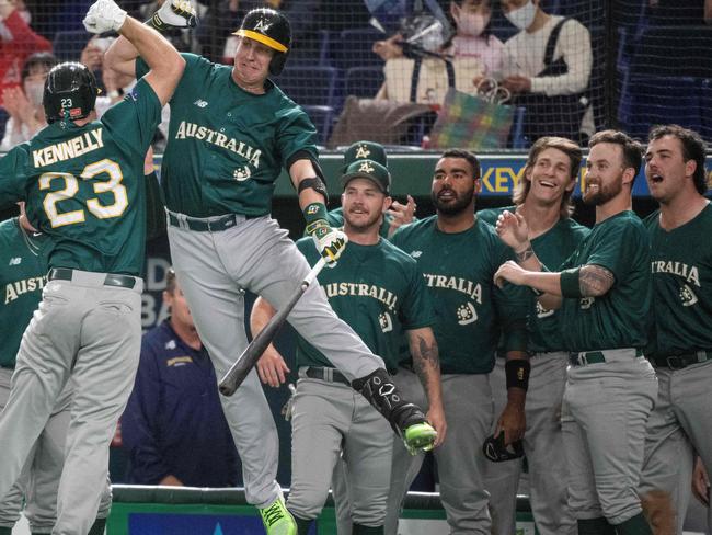 TOPSHOT - Australia's Timothy Kennelly (centre L) celebrates with teammates after hitting a home run during the World Baseball Classic (WBC) Pool B round game between Australia and South Korea at the Tokyo Dome in Tokyo on March 9, 2023. (Photo by Richard A. Brooks / AFP)