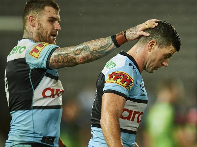 SYDNEY, AUSTRALIA - MARCH 21: Chad Townsend of the Sharks is embraced by Josh Dugan of the Sharks after missing a kick for goal during the round two NRL match between the Cronulla Sharks and the Canberra Raiders at Netstrata Jubilee Stadium, on March 21, 2021, in Sydney, Australia. (Photo by Brett Hemmings/Getty Images)