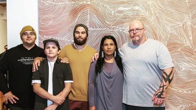 Mr Wirramanda-Knight and Ms Wirramanda, with their children, in front a painting by Mr Wirramanda-Knight at the Metro Gallery in Armadale. Picture: Instagram.