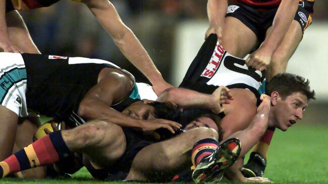 Mark Ricciuto and Josh Carr go at it on the field during the Round 5 Showdown in 2002.