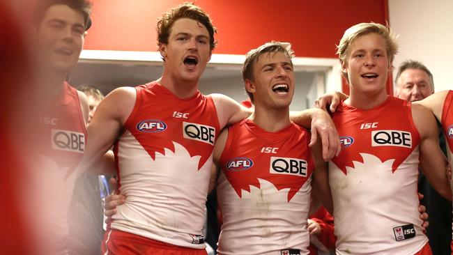 Kieren Jack celebrates a win with (from left) George Hewett, Gary Rohan and Isaac Heeney.