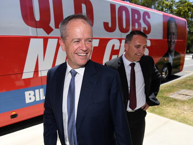 Federal Opposition Leader Bill Shorten (left) and Labor's candidate for Forde Des Hardman are seen next to the Queensland Jobs Not Cuts bus in Logan, south of Brisbane, Thursday, January 17, 2019. Mr Shorten will visit a number of marginal seats in the state in the coming days. (AAP Image/Dan Peled) NO ARCHIVING