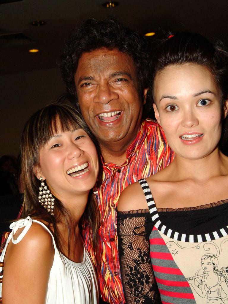 Musician Kamahl (c) with TV presenters Jade Skelly and Yumi Stynes at a Big Day Out after party at Sugar, Feb 2006.