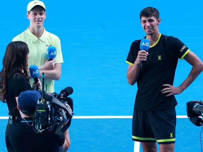 Popyrin and Sinner being interviewed after their charity match. Picture: Kelly Defina/Getty Images