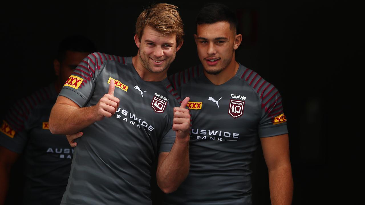 Origin forward Christian Welch with Queensland Maroons teammate Tino Fa'asuamaleaui. Picture: Chris Hyde/Getty Images