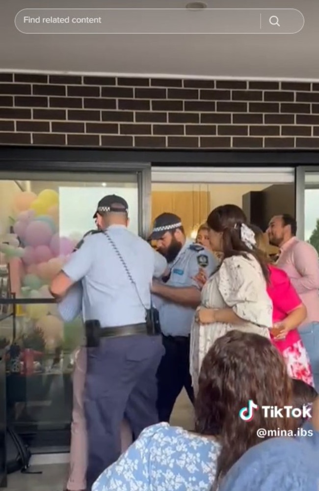 The fake police appeared to arrest the dad-to-be. Picture: TikTok