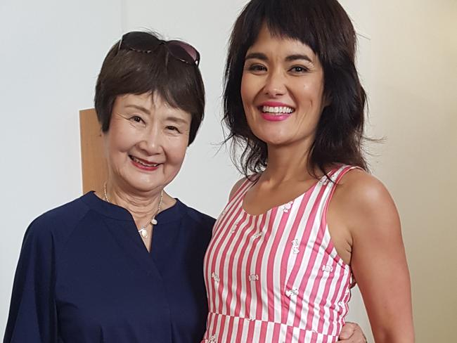 Yumi and her mum, who encouraged her to use moisturiser at an early age.