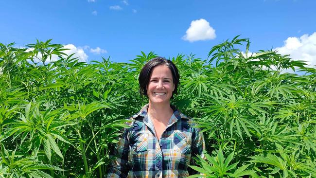 X-Hemp founder Andi Lucas inspects a crop.