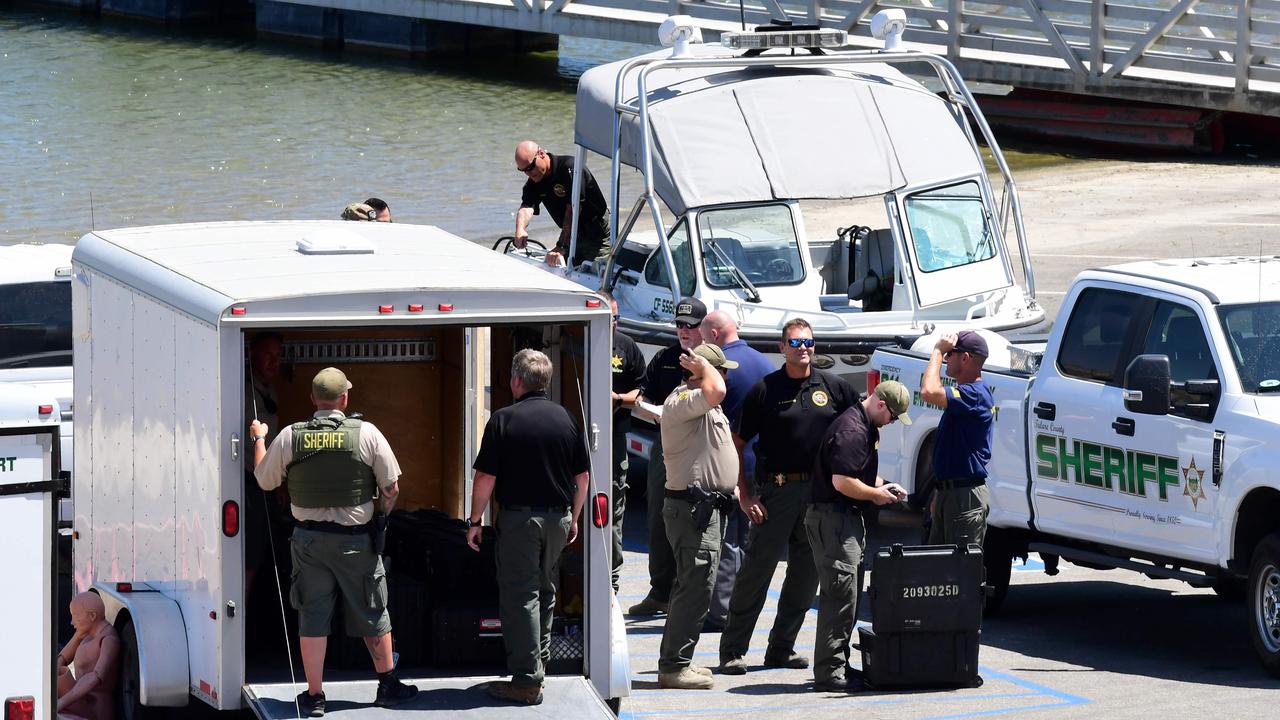 Law enforcement officials gather at the boating dock of Lake Piru. Picture: Frederic J. Brown/AFP