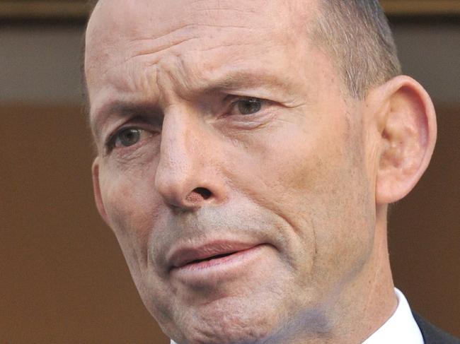 (FILES) In this file photo taken on September 09, 2015 Australian Prime Minister Tony Abbott speaks to the media during a press conference at Parliament House in Canberra. - Former Australian Prime Minister Tony Abbott was on September 4, 2020, appointed as a British trade envoy in Boris Johnson's Conservative government. (Photo by MARK GRAHAM / AFP)