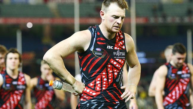 Brendon Goddard of Essendon looks dejected after defeat.