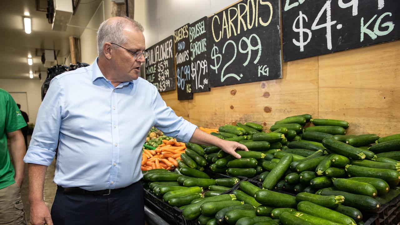 Prime Minister Scott Morrison visits a farmer’s market to buy some locally grown fruits and vegetables in Rockhampton. Picture: Jason Edwards