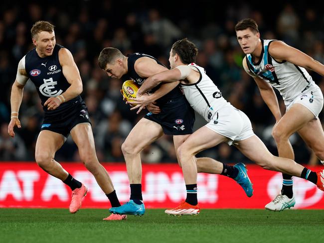 Sam Walsh is tackled by Zak Butters. Picture: Getty Images