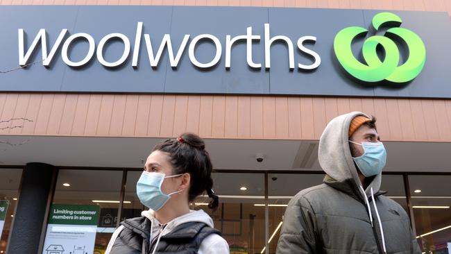 Shoppers outside a Woolworths store. Picture: Andrew Henshaw