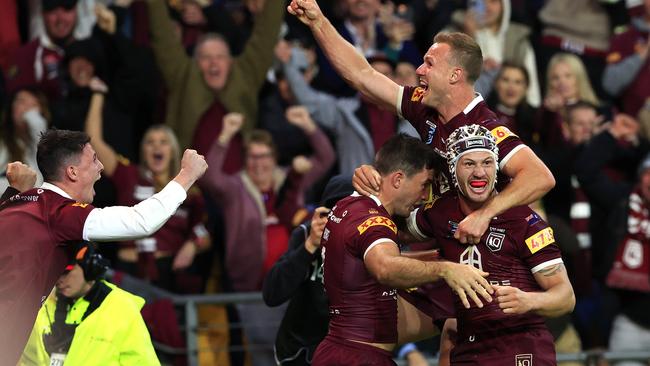 Daly Cherry-Evans and Kalyn Ponga celebrate with Ben Hunt and sealing a stunning upset at Suncorp Stadium. Picture: Adam Head