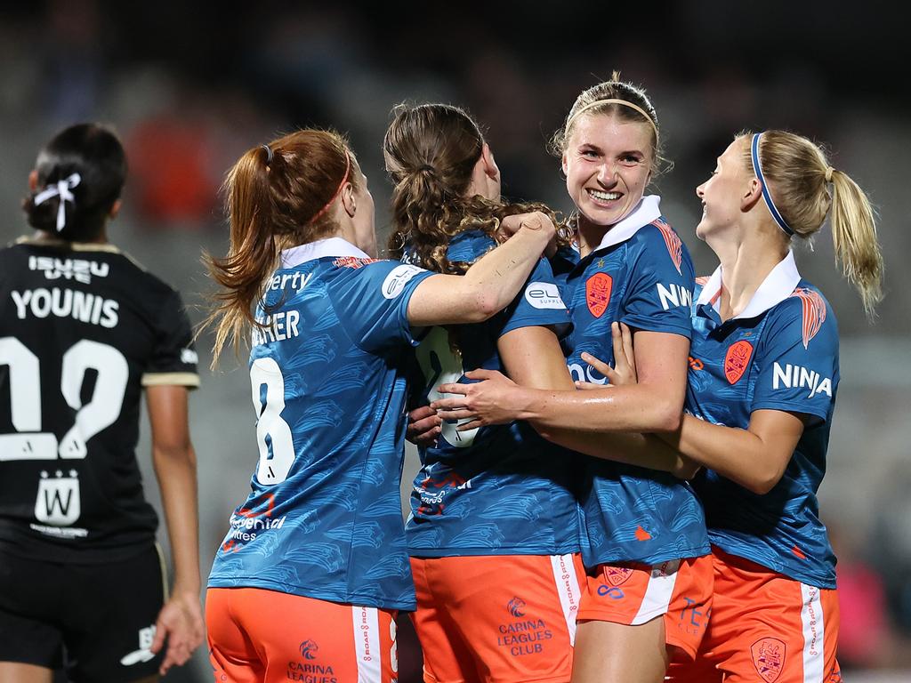 Emily Pringle celebrates a goal with Brisbane Roar teammate Chelsea Blissett. Picture: Brendon Thorne/Getty Images