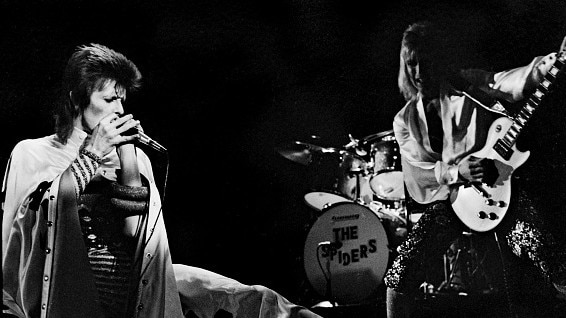 David Bowie, dressed as Ziggy Stardust, on stage with Mick Ronson of the Spiders From Mars at Earl's Court Arena in 1973. Picture: Gijsbert Hanekroot/Redferns