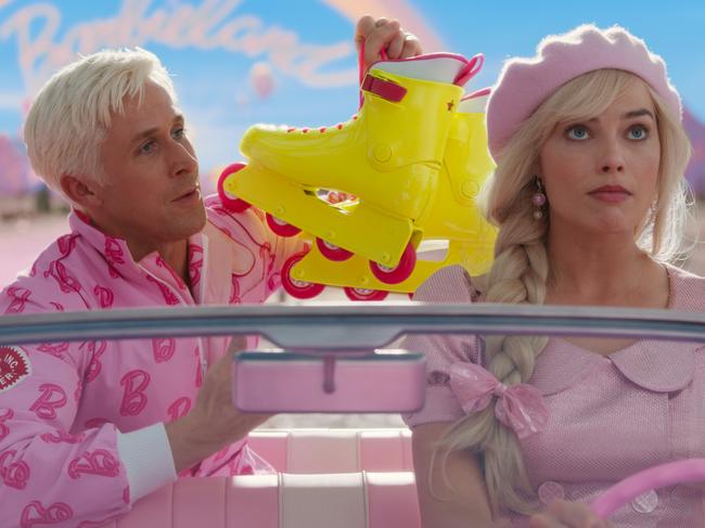 Ryan Gosling as Ken and Margot Robbie as Barbie in a scene from the movie Barbie.