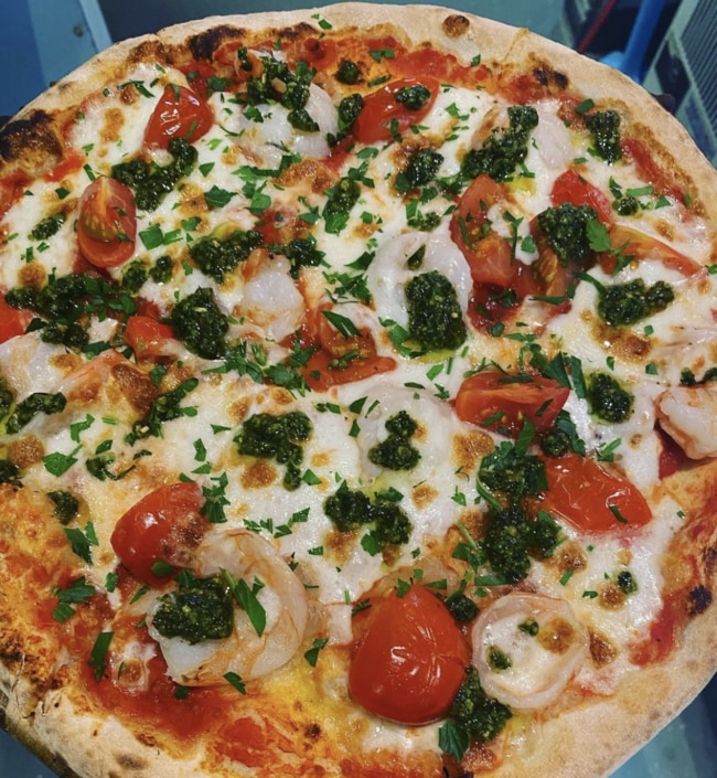 Il Forno's Gamberi (prawn) pizza uses a tomato base, mozzarella, prawns, cherry tomatoes and is topped with basil pesto and parsley. Picture: Instagram @ilforno_pizzeria