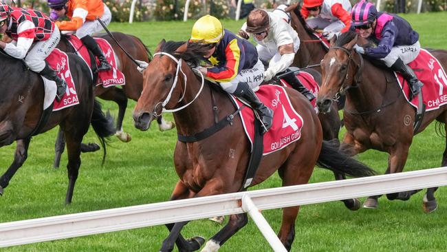 Jamie Kah drives home Goldrush Guru to victory in the Victoria Derby. Picture: George Sal/Racing Photos via Getty Images