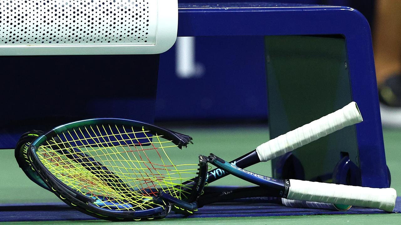 Two racquets were on the receiving end. (Photo by Elsa/Getty Images)