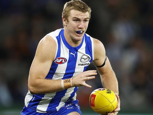 MELBOURNE, AUSTRALIA - AUGUST 20: Jason Horne-Francis of the Kangaroos runs with the ball during the round 23 AFL match between the North Melbourne Kangaroos and the Gold Coast Suns at Marvel Stadium on August 20, 2022 in Melbourne, Australia. (Photo by Daniel Pockett/Getty Images)